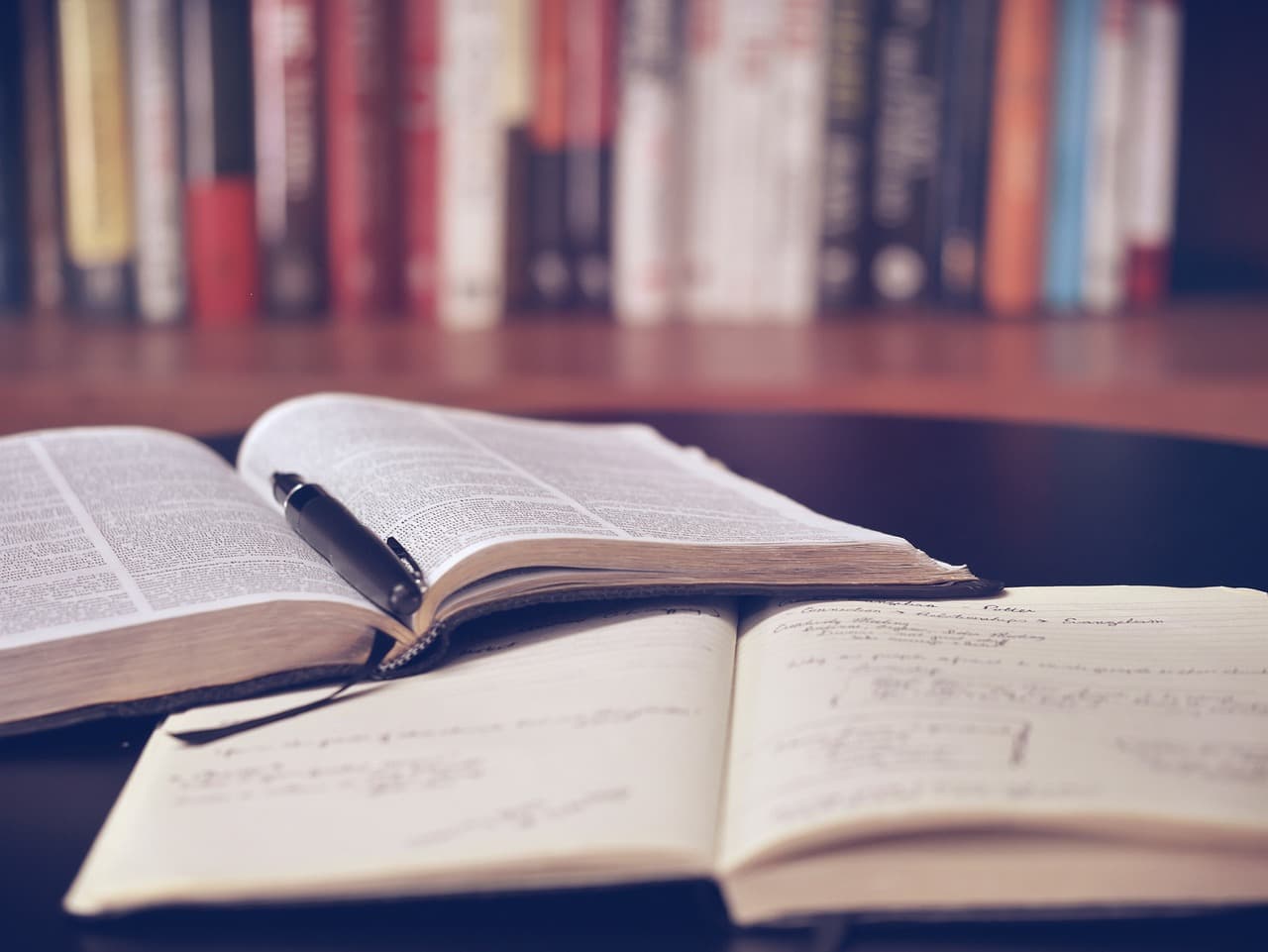 Books on a table in a library setting