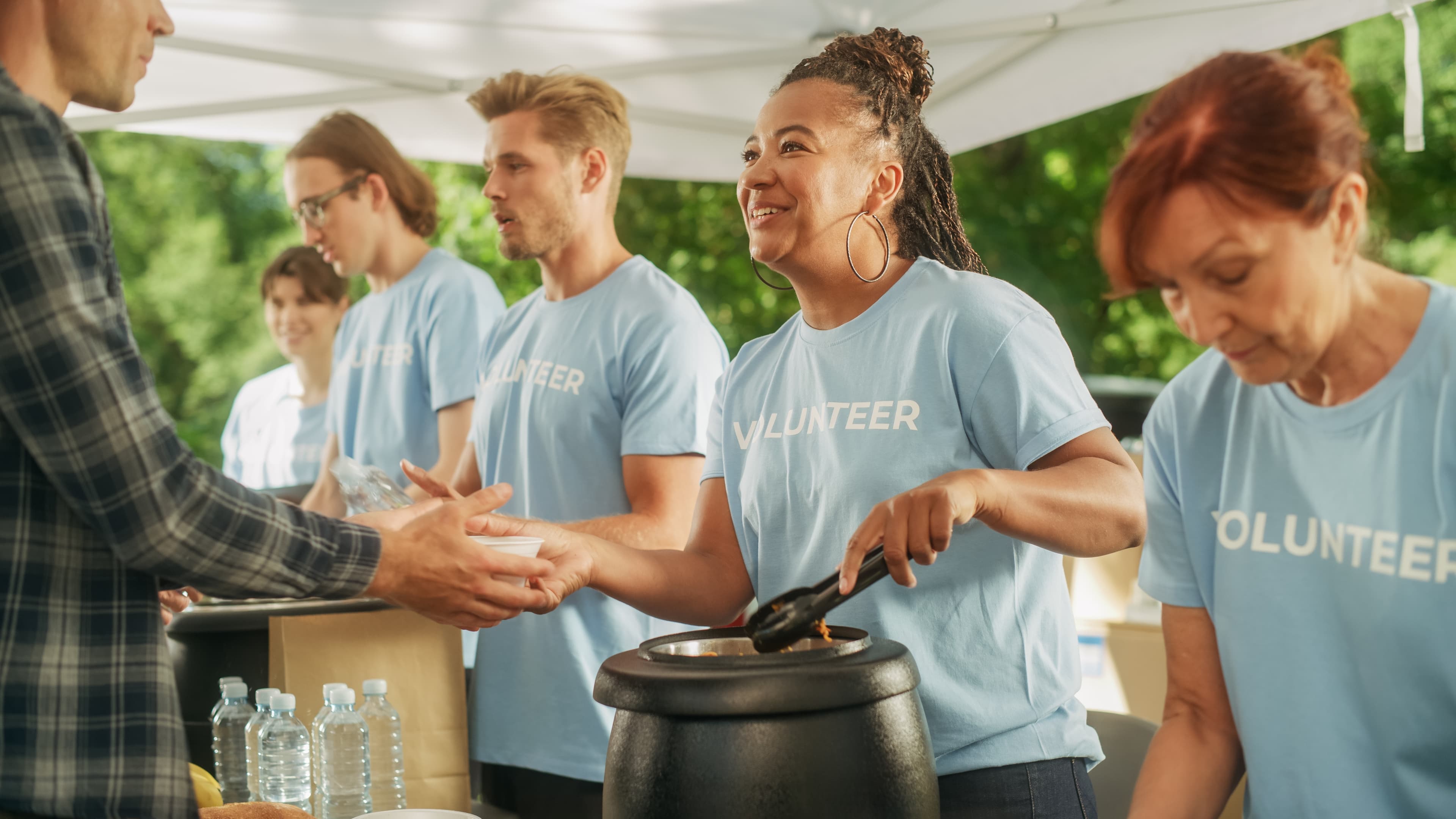 Volunteers serving food at a community event